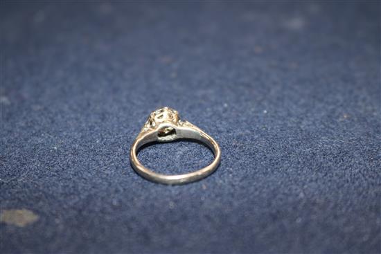 A diamond solitaire ring, the old-cut diamond approx 1.0ct, with diamond-set shoulders on white gold shank, size O.